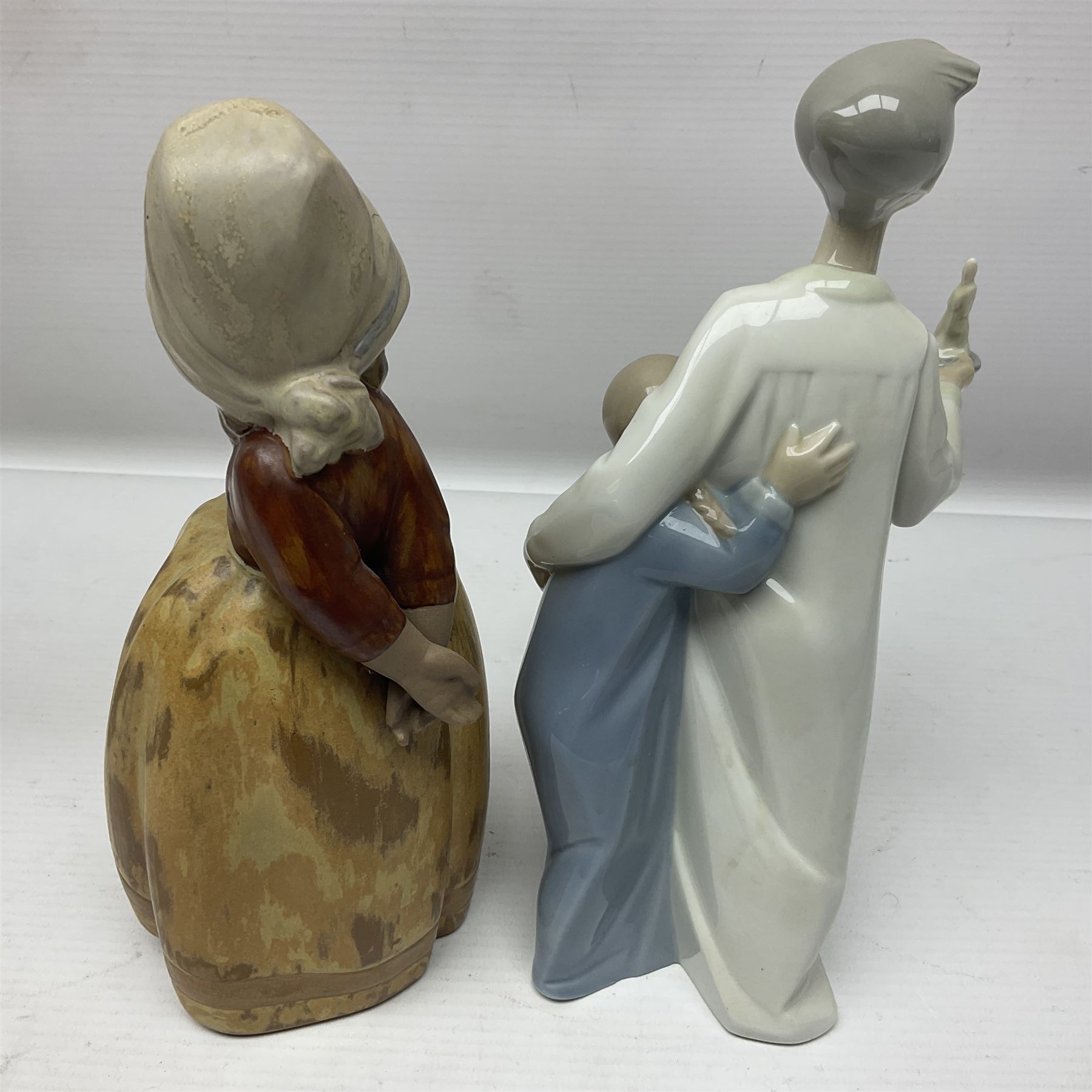 Four Lladro figures, including Girl With Cockerel no 4591, Gres Lonely no 2076 etc together with Nao figure 