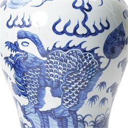 Pair of blue and white Chinese baluster vases and covers decorated with dragons, foliage etc H49cm
