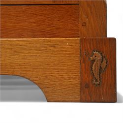 Seahorseman by Shaw & Riley - Yorkshire oak Welsh dresser, the dresser rack of rectilinear form with plain frieze and projecting moulded edge above two shelves with central shallow groove, the base section fitted with four drawers and a fitted cutlery drawer containing cutlery, above four panelled cupboard doors with geometric mouldings and carved sculpted handles, interior with single shelf and sides with geometric mouldings raised on a shallow plinth base with shaped bracket feet, with signature Seahorse carving from the workshop from the workshop of A. Shaw & Riley Ltd, Hessay