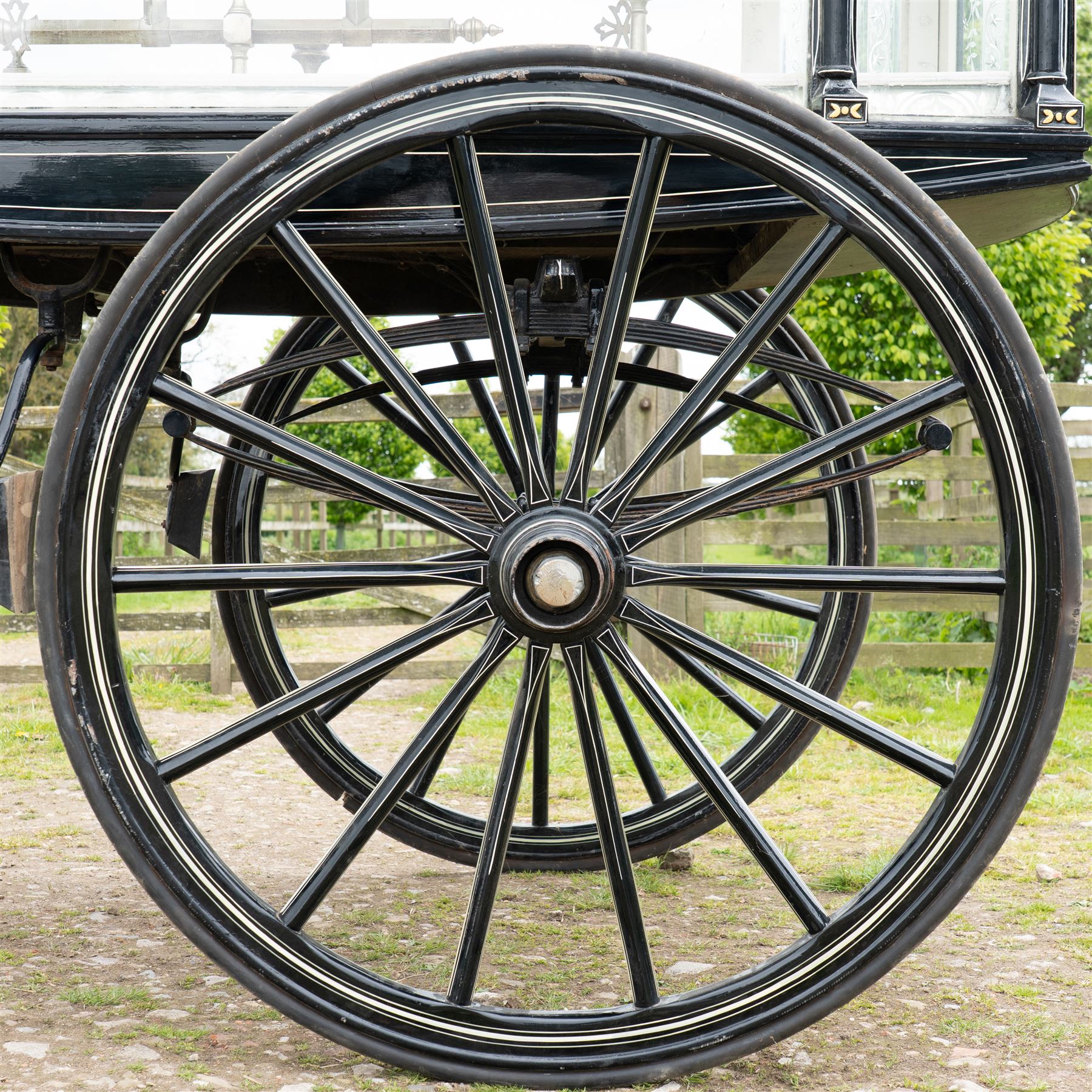 Victorian Glass Hearse

A black painted four wheeled horse drawn glass hearse with extensively glazed coffin compartment, etched glass side and end panels, decorative gilt cresting, gilt column capitals, white painted interior bier deck, metal coffin rails with cross finials, rear glazed access doors, external coachman's box seat for two, wooden spoked wheels the wheel hubs stamped 'The Economic Funeral Co', leaf spring suspension, underbody turntable steering and pole for driving with a pair of horses. The hearse has decorative painted lining throughout and an ornate black and gilt body with curved glass panels to the sides and rear.

Features

• Extensively glazed coffin compartment
• Etched glass side and end panels
• Decorative gilt cresting
• Gilt column capitals
• White painted interior bier deck
• Metal coffin rails with cross finials
• Rear glazed access doors
• External coachman's box seat
• Wooden spoked wheels
• Leaf spring suspension
• Underbody turntable steering
• Pole for driving with a pair of horses
• Decorative painted lining

Dimensions:
Overall length: 406 cm
Body length: 250 cm
Overall width: 190 cm
Body width: 115 cm
Height: 228 cm

Wheel Diameters:
Front wheels: 102 cm
Rear wheels: 133 cm

Seating

Coachman's box seat: 2