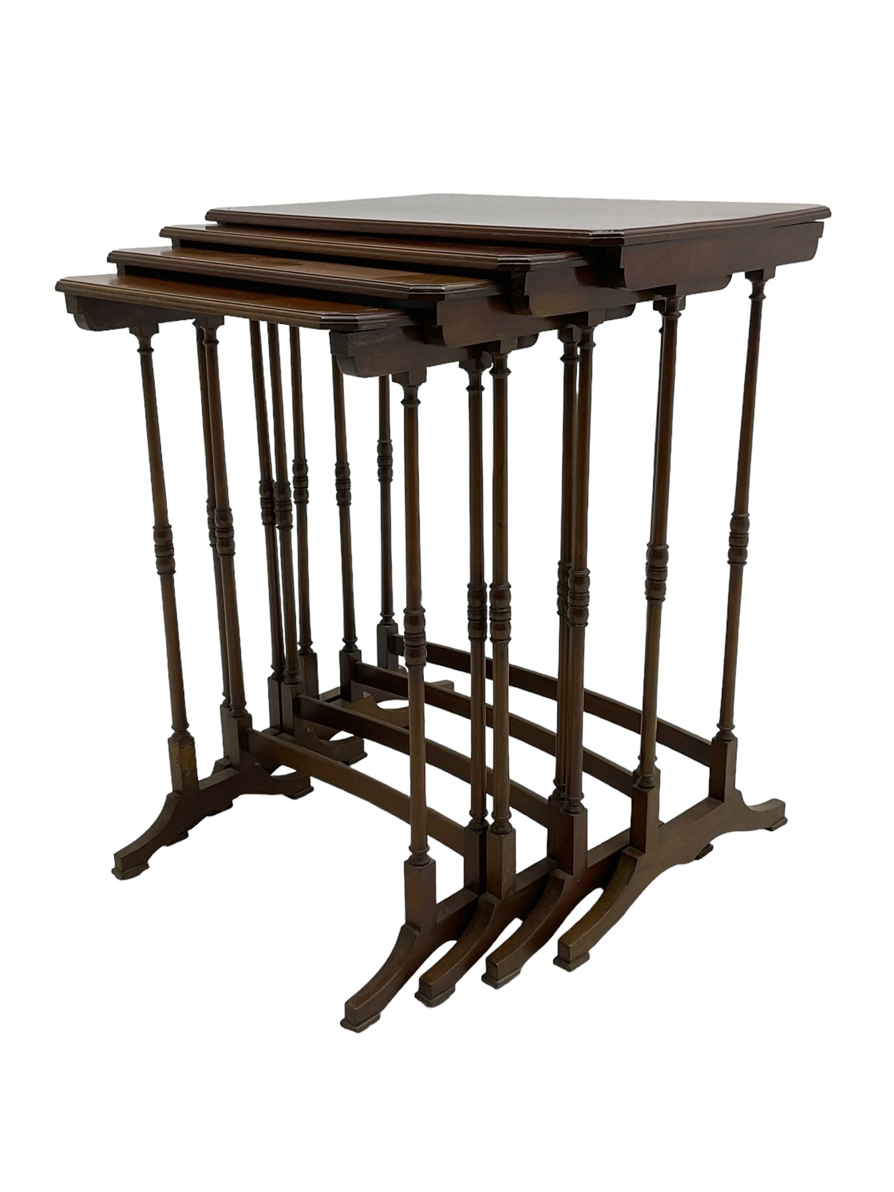 Early 20th century mahogany quartetto nest of four occasional tables, moulded canted rectangular tops on turned supports, on sledge feet