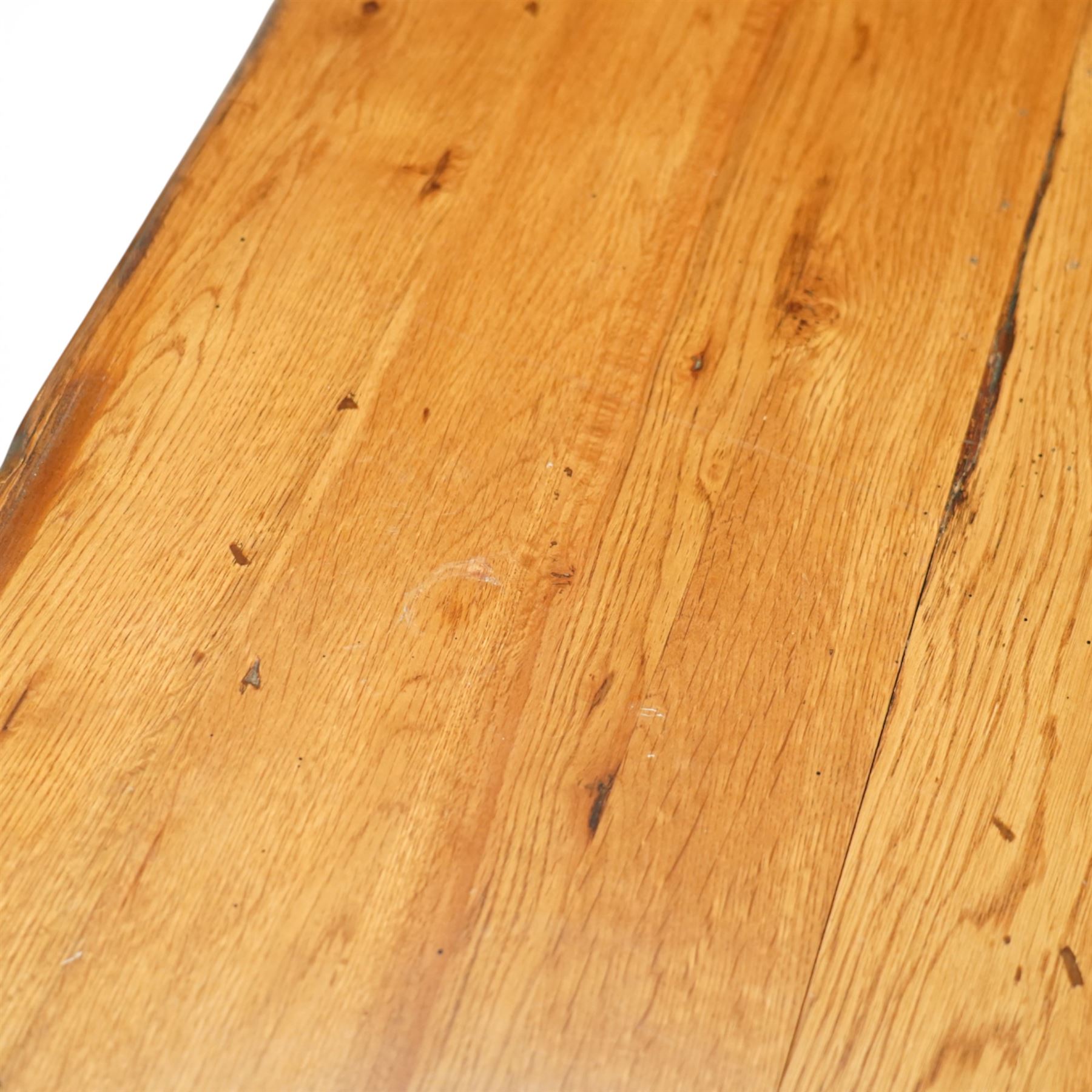 Late 20th century light oak extending refectory table, in the manner of Titchmarsh & Goodwin, rectangular plank top with cleated ends and two draw leaves extending to 260cm, supported on turned end supports united by a stretcher, raised on block feet