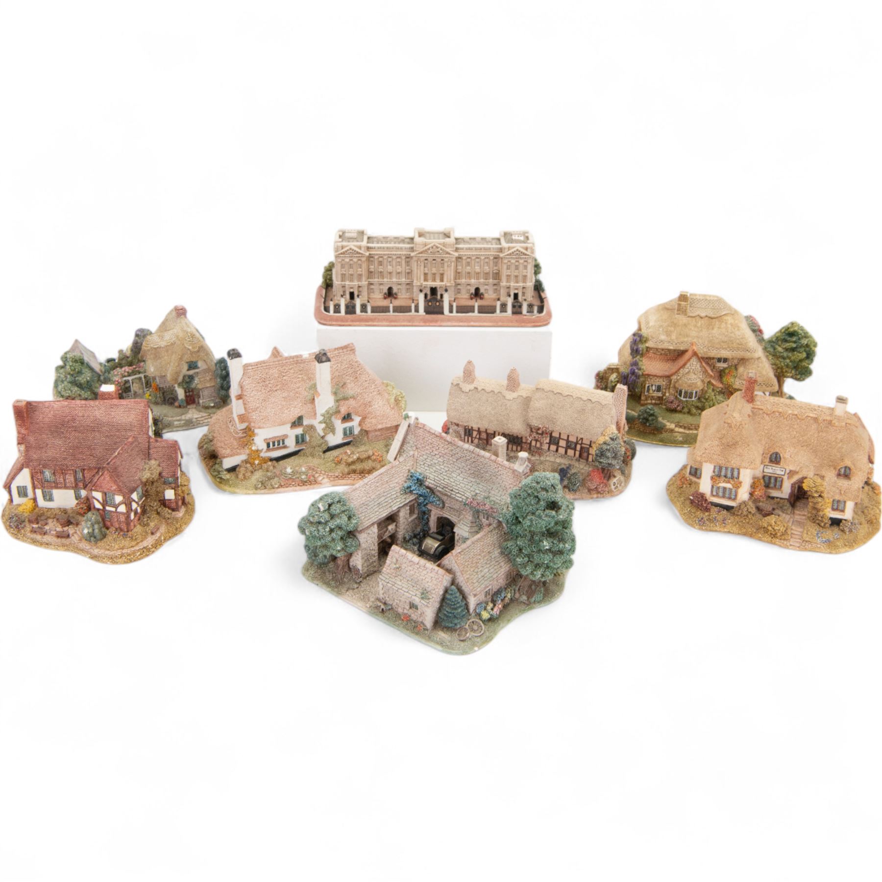 Eight Lilliput Lane models, comprising Heritage Collection Buckingham Palace, Crown Inn, Anne Hathaway, Periwinkle Cottage, Royal Oak Inn, Through The Keyhole, Burley Street Garage and The George Inn