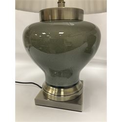 Pair of table lamps of squat baluster form, with a crackle glaze to a dark grey ground, upon a square base, including shade H57cm