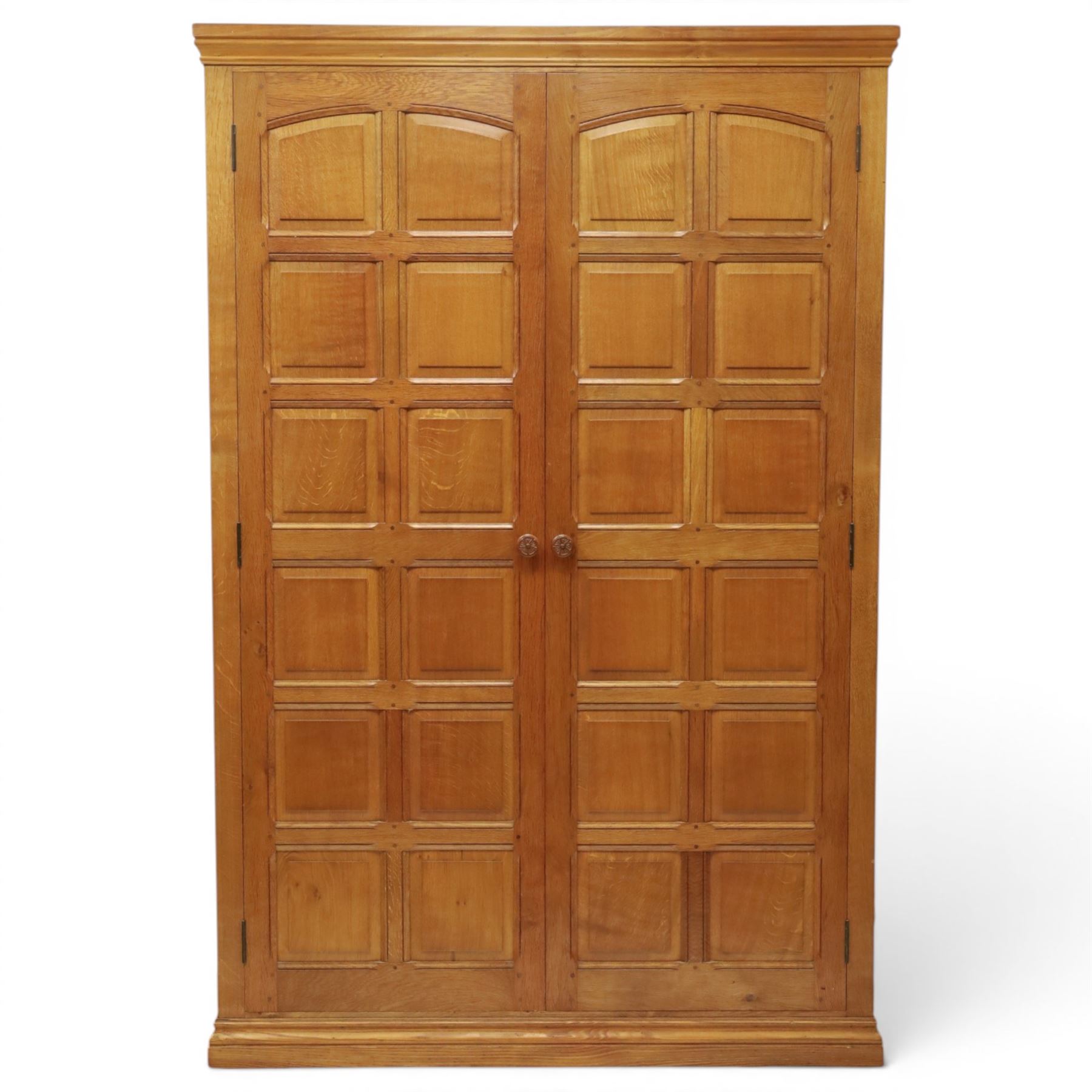 Beaverman - oak double wardrobe, enclosed by twin multi-panelled doors, Yorkshire Rose carved handles, the interior fitted with shelf and hanging rail, with signature carved beaver, by Colin Almack of Sutton, near Thirsk