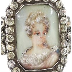 19th century 18ct gold and silver paste set portrait ring, octagonal miniature of a woman on ivory, under a glazed panel, with paste stone surround, to bifurcated paste set shoulders. This lot has been registered for sale under Section 10 of the APHA Ivory Act