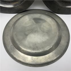 Group of seven 19th century pewter chargers, each of circular form with dished centre, two examples with touch marks verso, each approximately D39cm