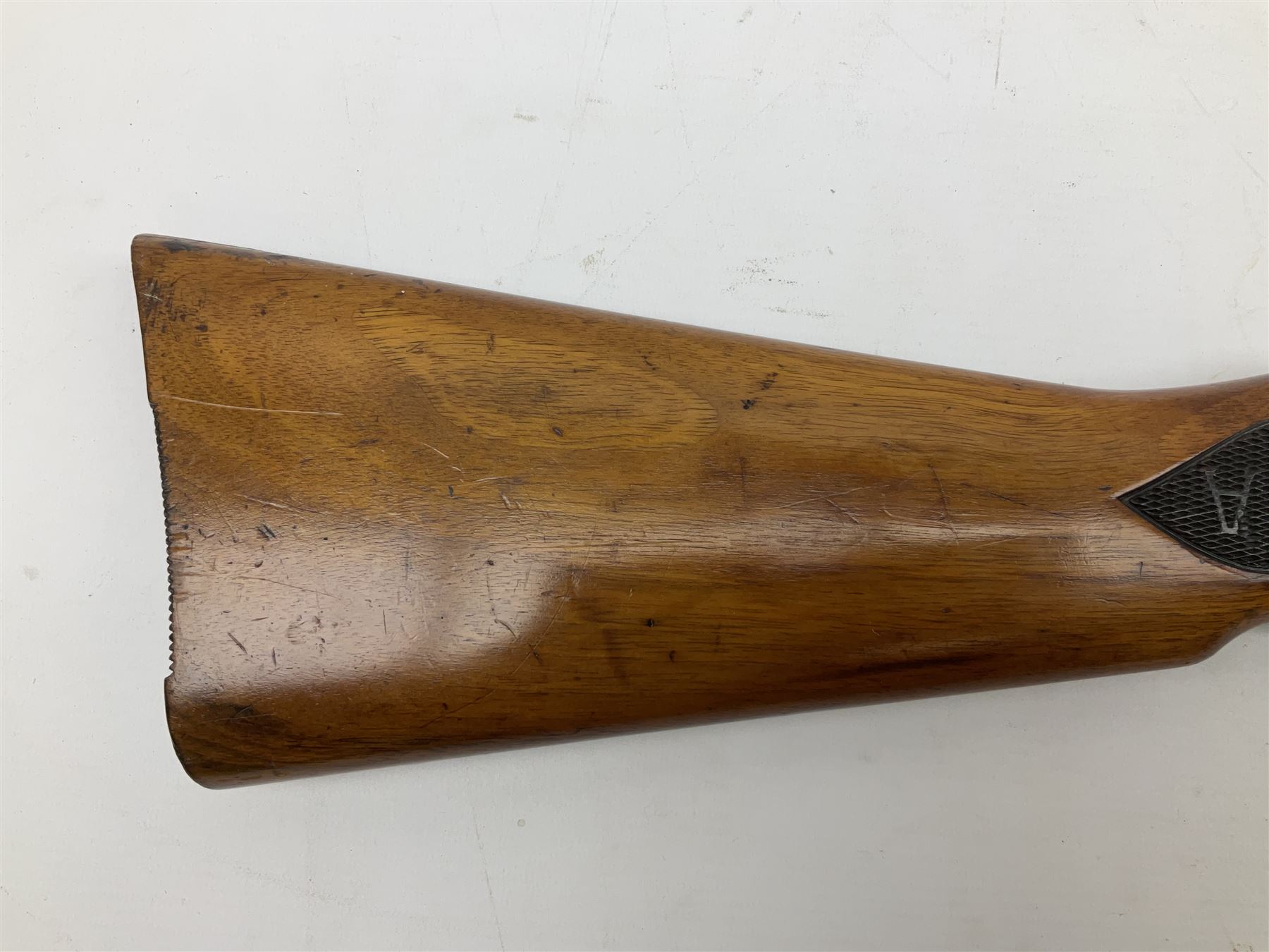 BSA .177 air rifle with top loading under lever action, walnut stock carved with chequered BSA logo to grip, serial no.A1203 L102cm