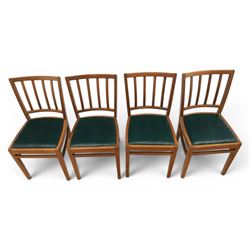 Mid 20th century teak extending dining table, together with eight teak chairs with green leather seats, extends to 154cm