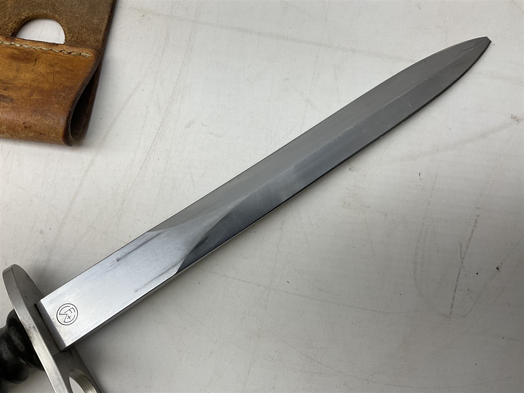 Schmidt-Rubin Model 1918 bayonet, the 30cm steel blade marked Elsener Schwyz, cross-piece numbered 813558; in steel scabbard with leather frog stamped E. Banga Sattler Selzac 67 L45.5cm overall; and Swiss Model 1957 SIG rifle bayonet by Wenger; in plastic scabbard with leather frog stamped E. Walty Sattlerei Baretswil 84 (2)