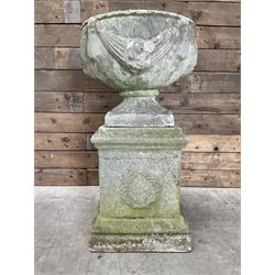 Cast stone centerpiece urn on plinth