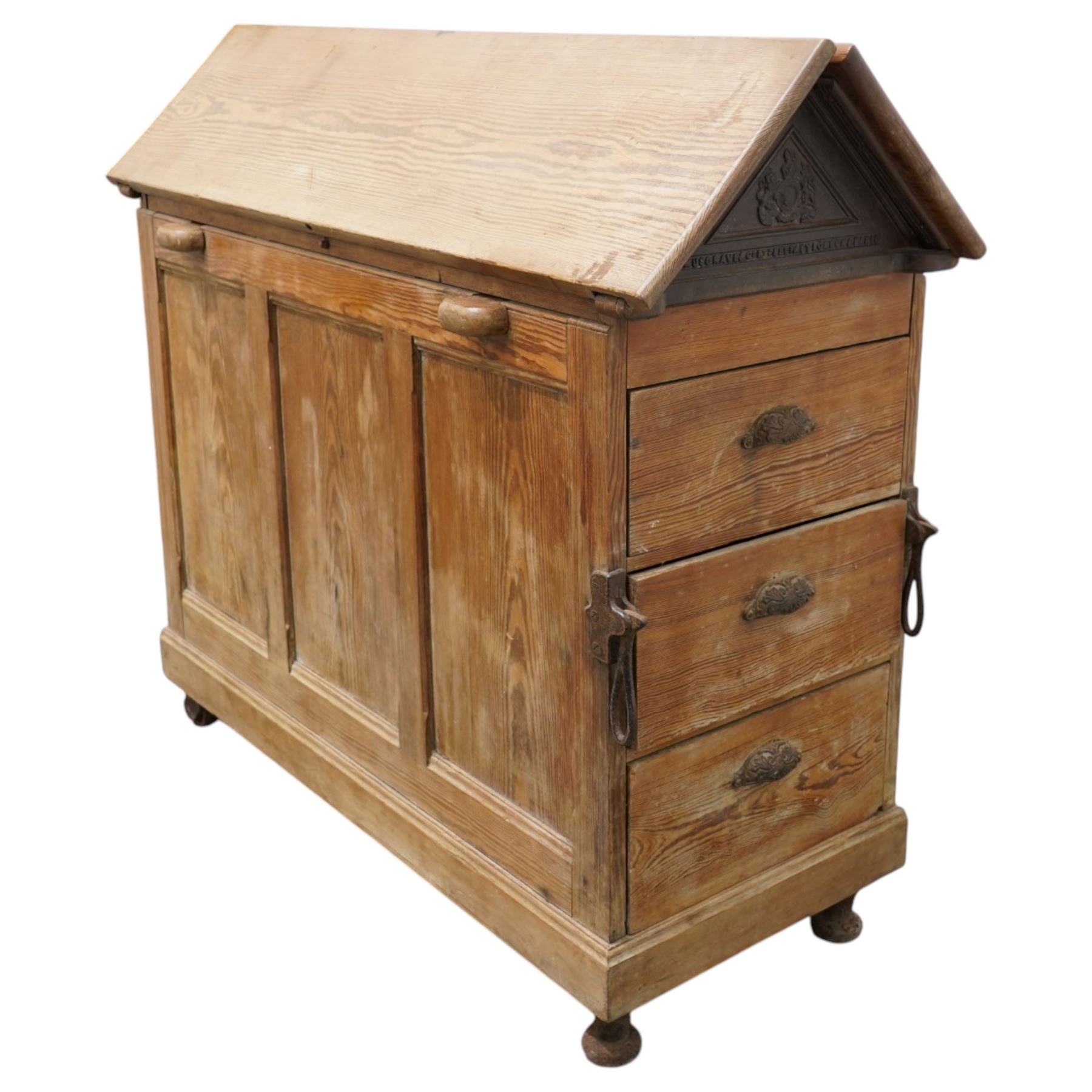 Musgrave & Co Ltd (Belfast) - late 19th century pine saddle horse, with three drawers to one end and cupboard door to the other, the hinged top opening to form a table, the cast iron plaque bears the Royal coat of arms and maker's name