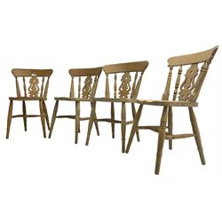 Set of four 20th century beech farmhouse kitchen chairs, pierced shaped back splat over saddle seat, raised on ring turned supports joined by H-stretcher