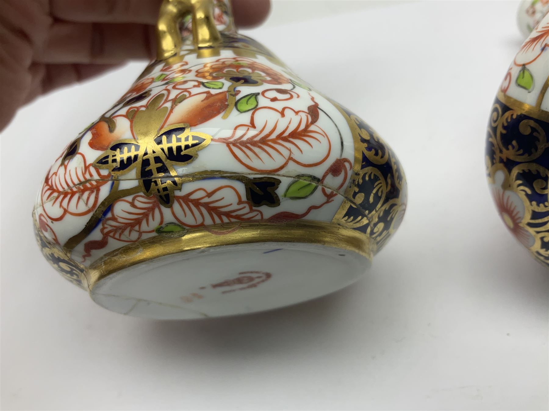 Pair of Royal Crown Derby 6299 imari pattern miniature vases