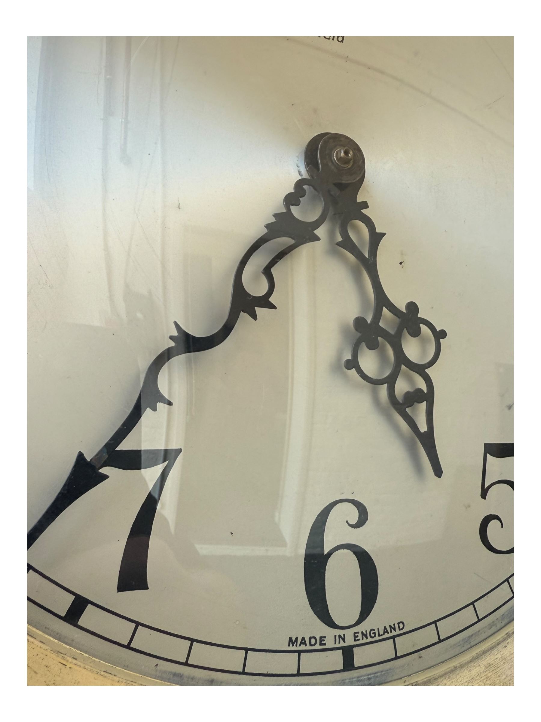 English- Art deco mahogany 8-day longcase clock, with an arched top and fill length fully glazed door beneath, on a short plinth with bracket feet, three train chain driven movement with visible stainless steel cased weights and pendulum, silvered dial with Arabic numerals, minute track and pierced steel hands, quarter chiming movement with  Westminster/ Whittington/ strike/silent selection.
