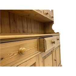 Waxed pine dresser, glazed doors with five spice drawers, above three drawers and three cupboards
