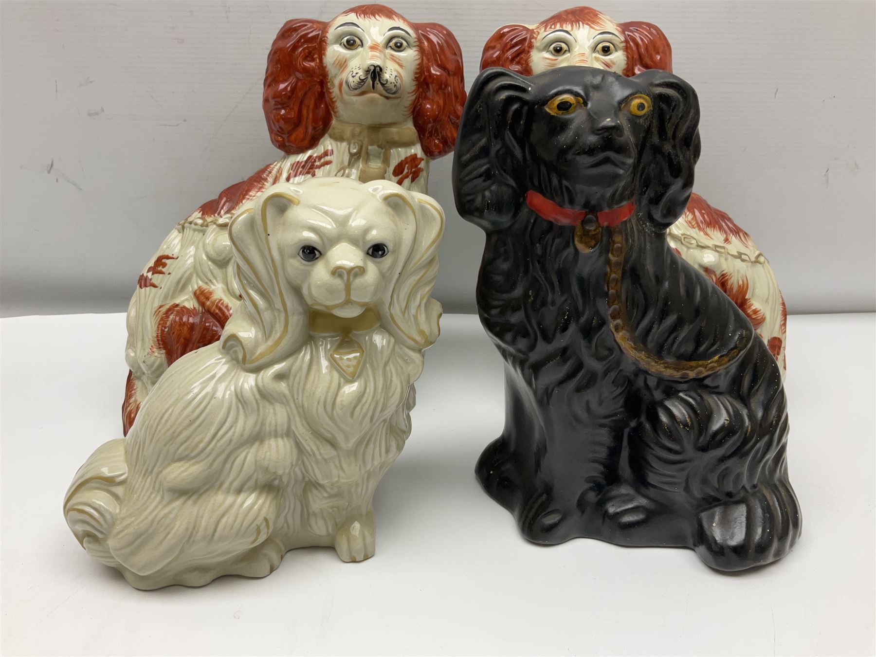 Two Pairs of Staffordshire style dogs, together with three other examples, largest example H27cm