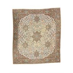 Large Persian design carpet, overall floral design, the field decorated with large rosette motifs surrounded by trailing foliate motifs, the border decorated with trailing branch and stylised plant motifs