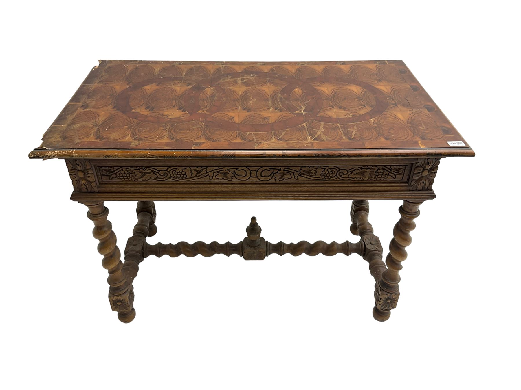 Early 20th century carved oak side table, the rectangular top with cross section inlay, frieze carved with foliate decoration, raised on spiral turned supports united by barley-twist stretcher with finial