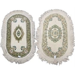 Two oval Indian woollen rugs, floral design