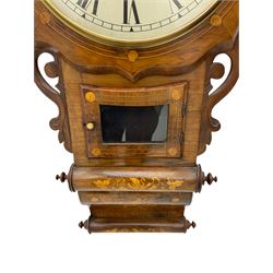 An American drop dial wall clock in a light mahogany case with inlay, scalloped wooden dial bezel and glazed pendulum door, with a 12” cream dial with Roman numerals, minute track and steel moon hands, eight day striking movement striking the hours on a bell. With pendulum


