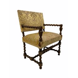 Early 20th century wide seat upholstered armchair, barley twist framed with bust carved arm supports