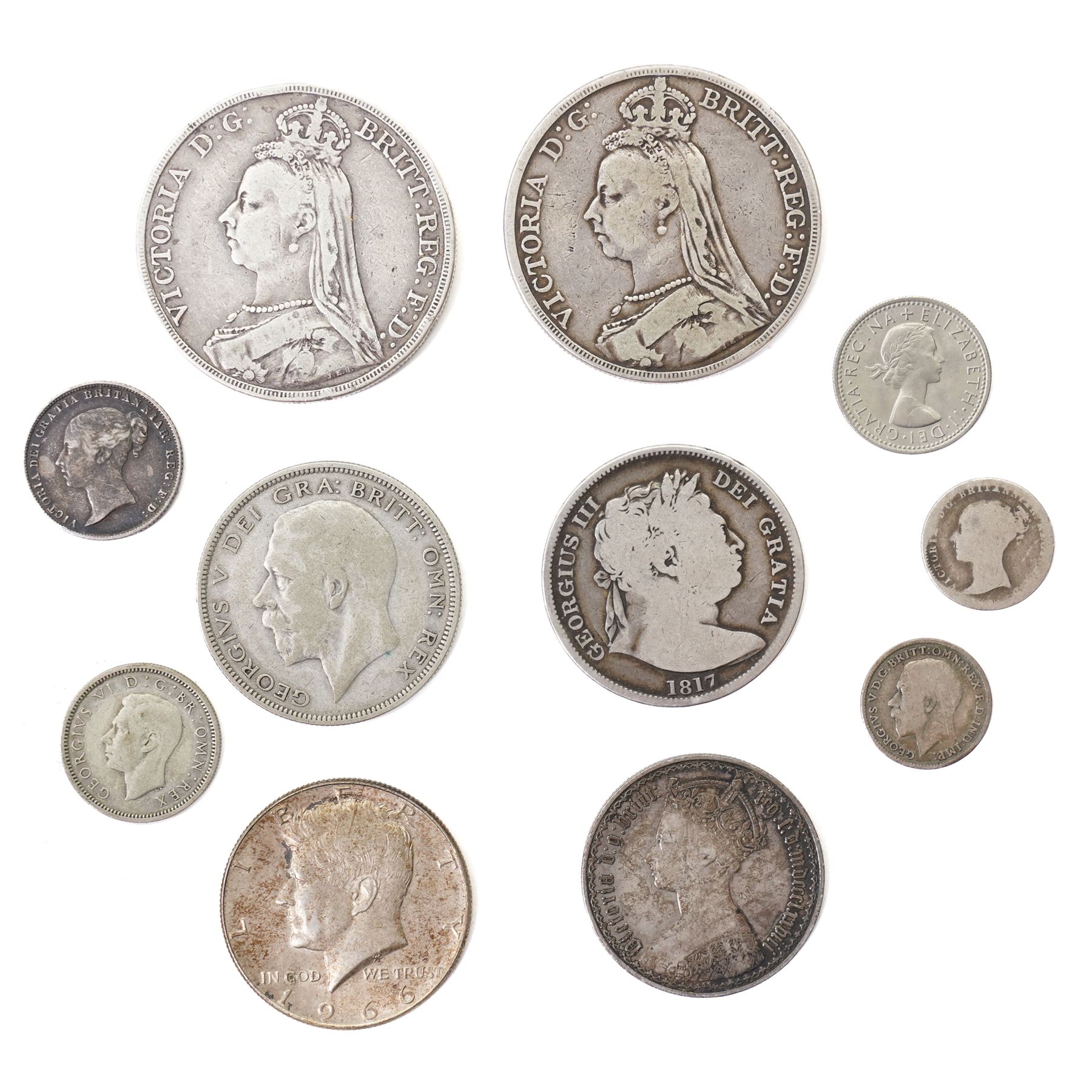 Two Queen Victoria silver one crown coins, 1889 and 1890, George III 1817 silver half crown, King George V 1935 silver half crown, and seven further coins