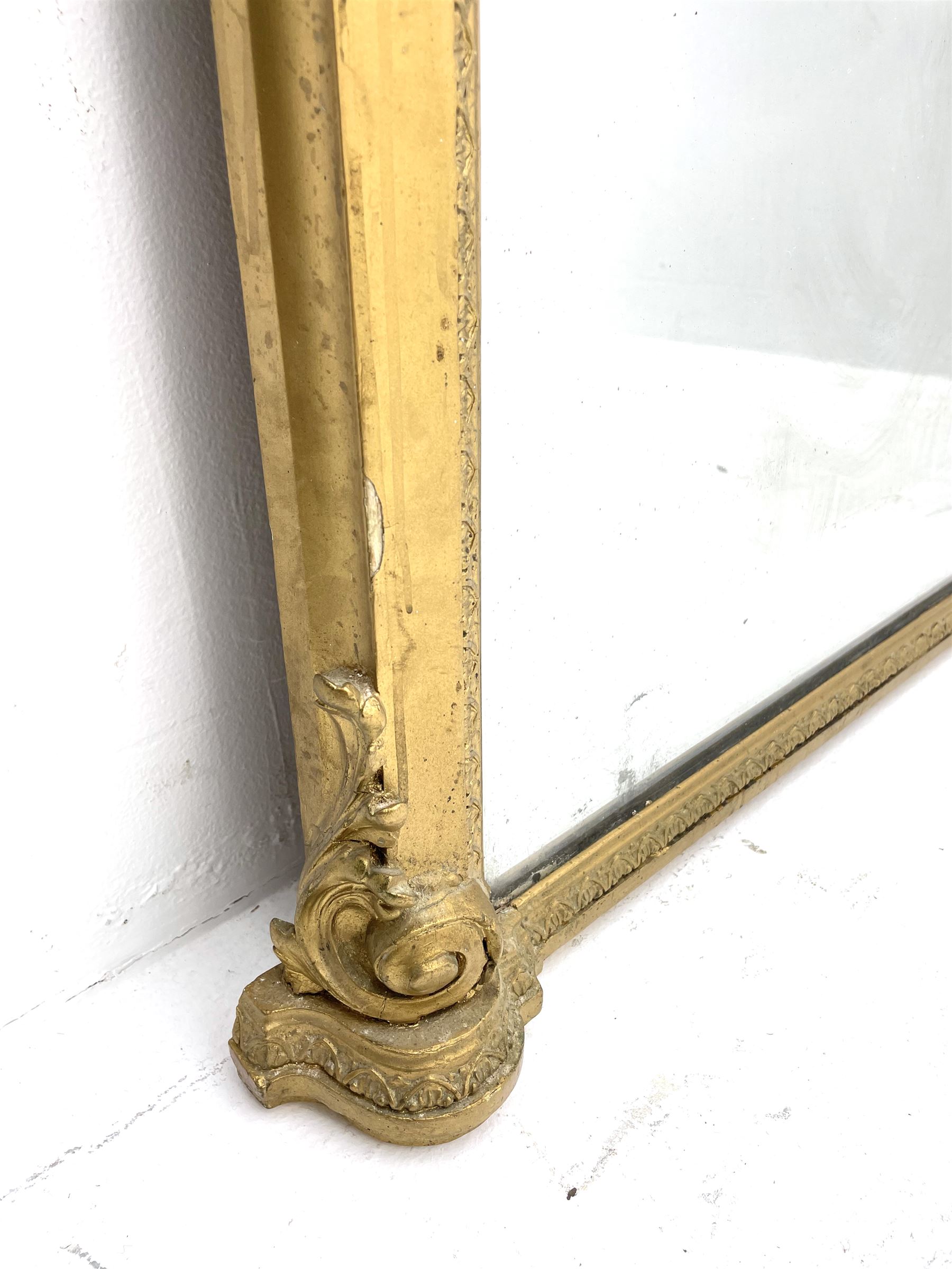 Tall Victorian hall mirror, in arched gilt frame with foliate mould slip, acanthus scroll corner brackets 