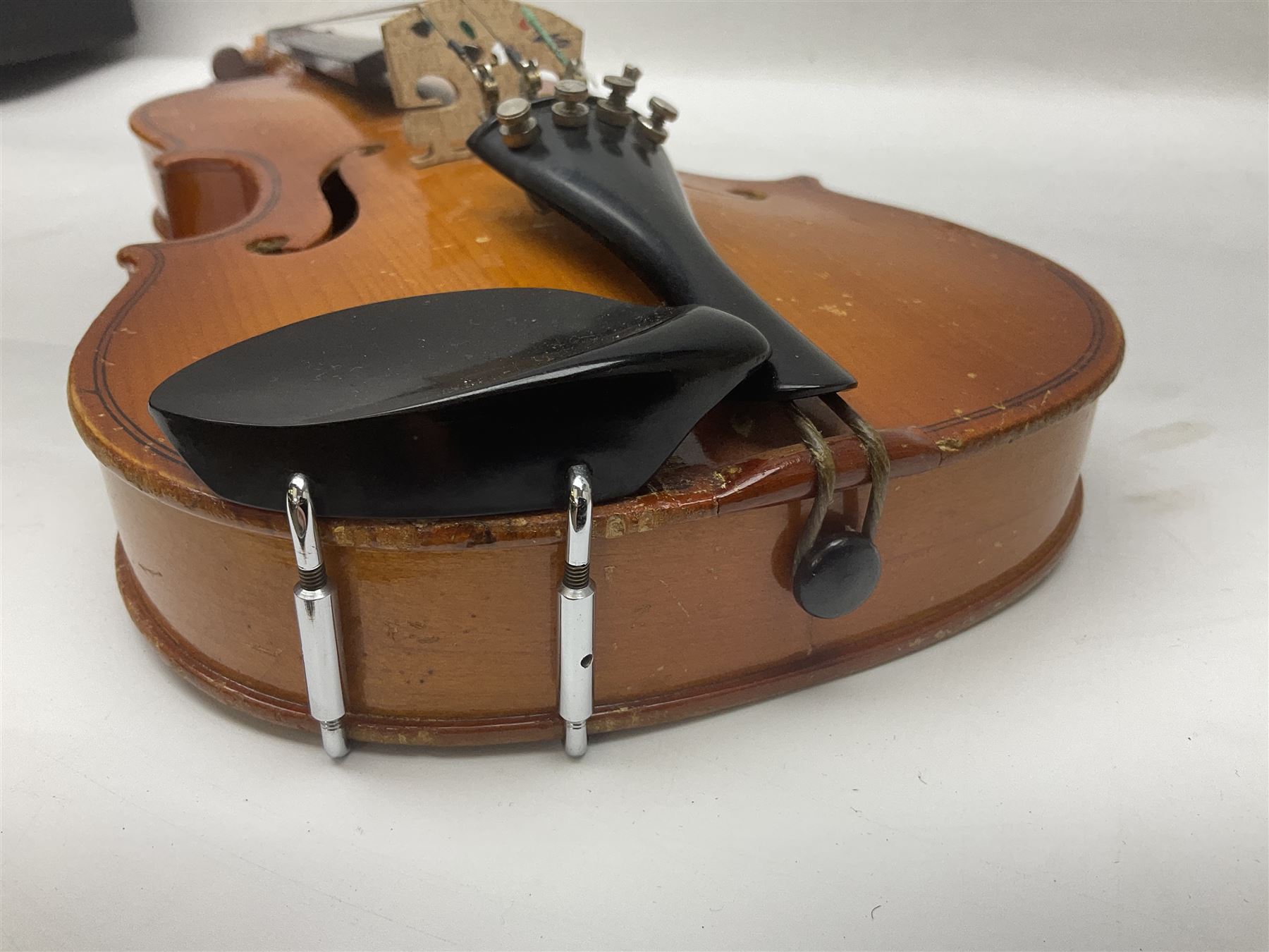 Four Chinese graduated violins - full size with 35.5cm two-piece back; three-quarter size with 33.5cm two-piece back; half size with 31cm two-piece back; and quarter size with 27.5cm two-piece back; all cased except full size; one with bow (4)