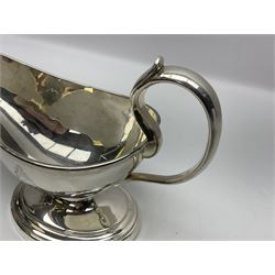 Christofle silver-plated sauce boat, of typical plain form, with capped C scroll handle and engraved anchor crest to body, upon a stepped oval foot, stamped 22 Christofle to base, including handle H14cm