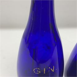 Pair of early 19th century blue glass decanters with teardrop stoppers, with gilt writing, the first marked Gin the second Brandy 