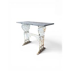 Victorian cast iron garden table, rectangular slate top raised on pierced scrolling foliat...