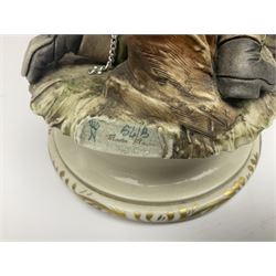 Three Capodimonte figures, to include The Kind Heart Man, modelled by Cortese as a tramp with two doves, The Young Falconer by Maria Angela and another modelled as a tramp darning his socks, all with printed marks, tallest H39cm