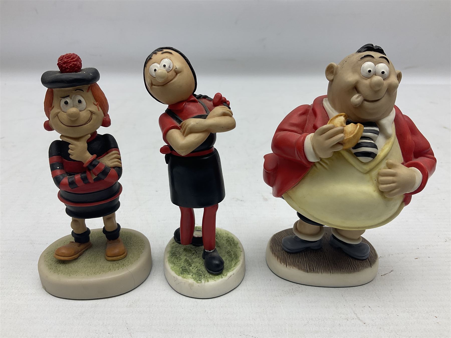 Eleven Robert Harrop figures from the Beano Dandy collection, comprising One Man & His Dawg BDS08, Picnic Desperate Dan BDS04, Fatty BD07, Desperate Dan BD03, Roger the Dodger BD20, Dennis the Menace BD01, Beryl the Peril BD05, Minnie the Minx BD04, Surfing BP03, two Spotty BD16, together with a Genuine Beano Ware lidded box (12)