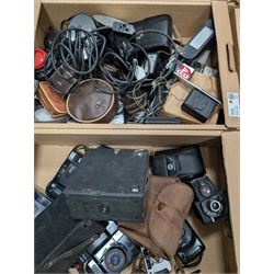 Collection of vintage cameras, projectors and accessories, including Kodak Brownies, Praktica, Polaroid, Ensign, light meters, flashes, etc