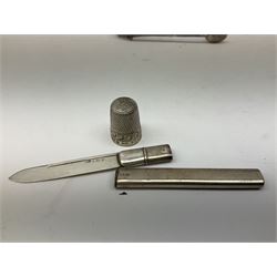 Small group of silver, to include Georgian Fiddle pattern teaspoon, later teaspoon, sugar tongs, etc., all hallmarked, approximate weighable silver 59 grams, approximate gross weight 113 grams