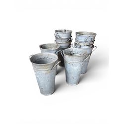 Nine galvanised flower buckets, tapering form with twin handles