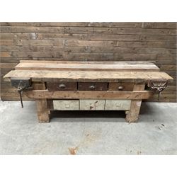 Large vintage work bench, fitted with six drawers and two vice