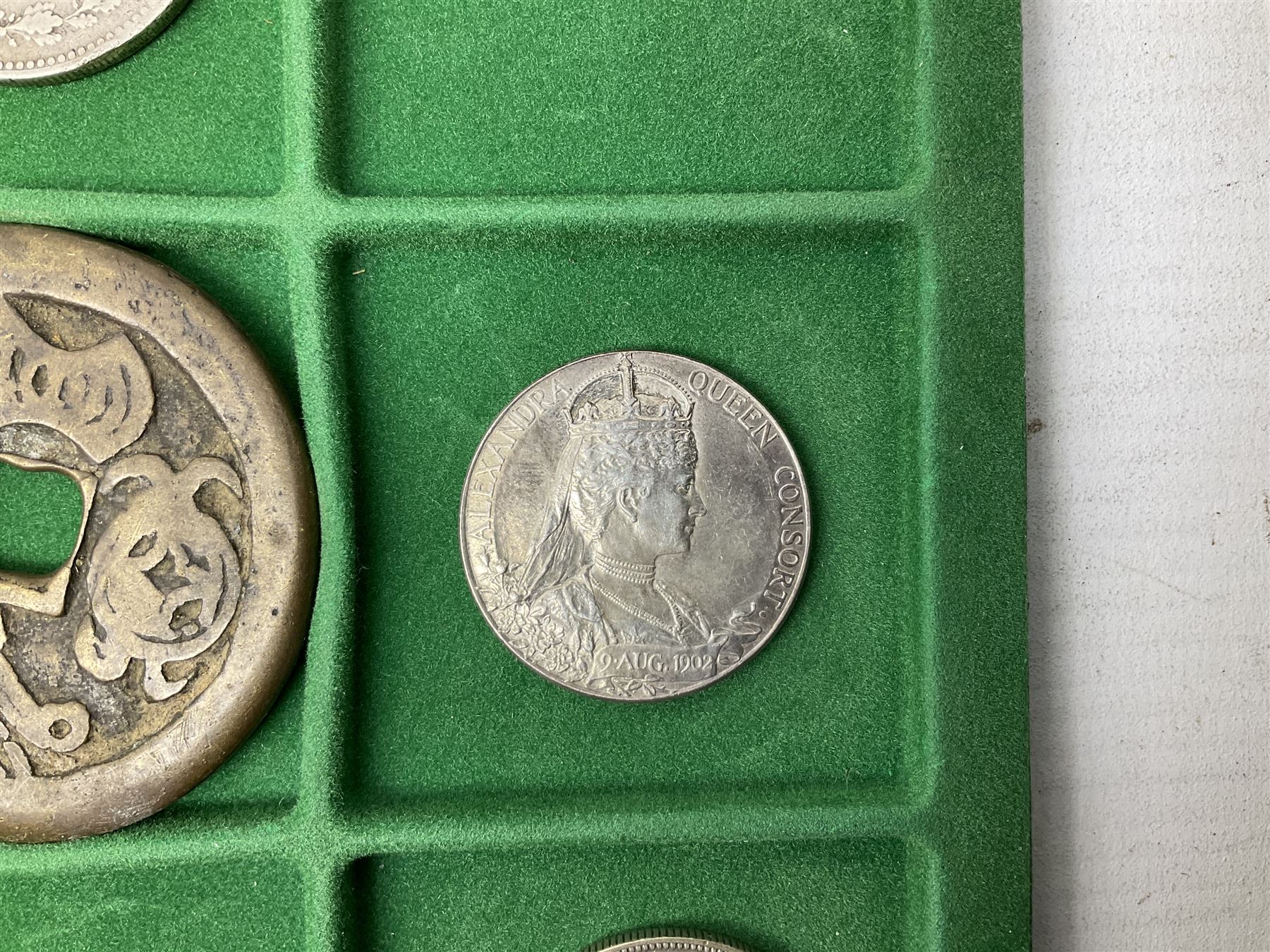 Coins and medallions including, York 1811 one shilling cattle and barber silver token, United States of America 1883O silver Morgan dollar, birds of destiny medal by Malcolm Appleby, Great British King George V 1930 halfcrown, King Edward VII 1902 silver medal, King George V 1916 halfcrown etc, housed in a case with lift out green coin trays