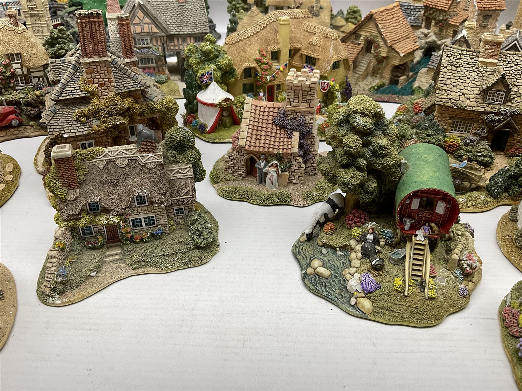 Twenty six Lilliput Lane models, to include Golden Harvest, Junk and Disorderley, Heaven Lea Cottage, Old Scrumpy Farm, Chantry Chapel Wakefield, etc, together with four similar cottages