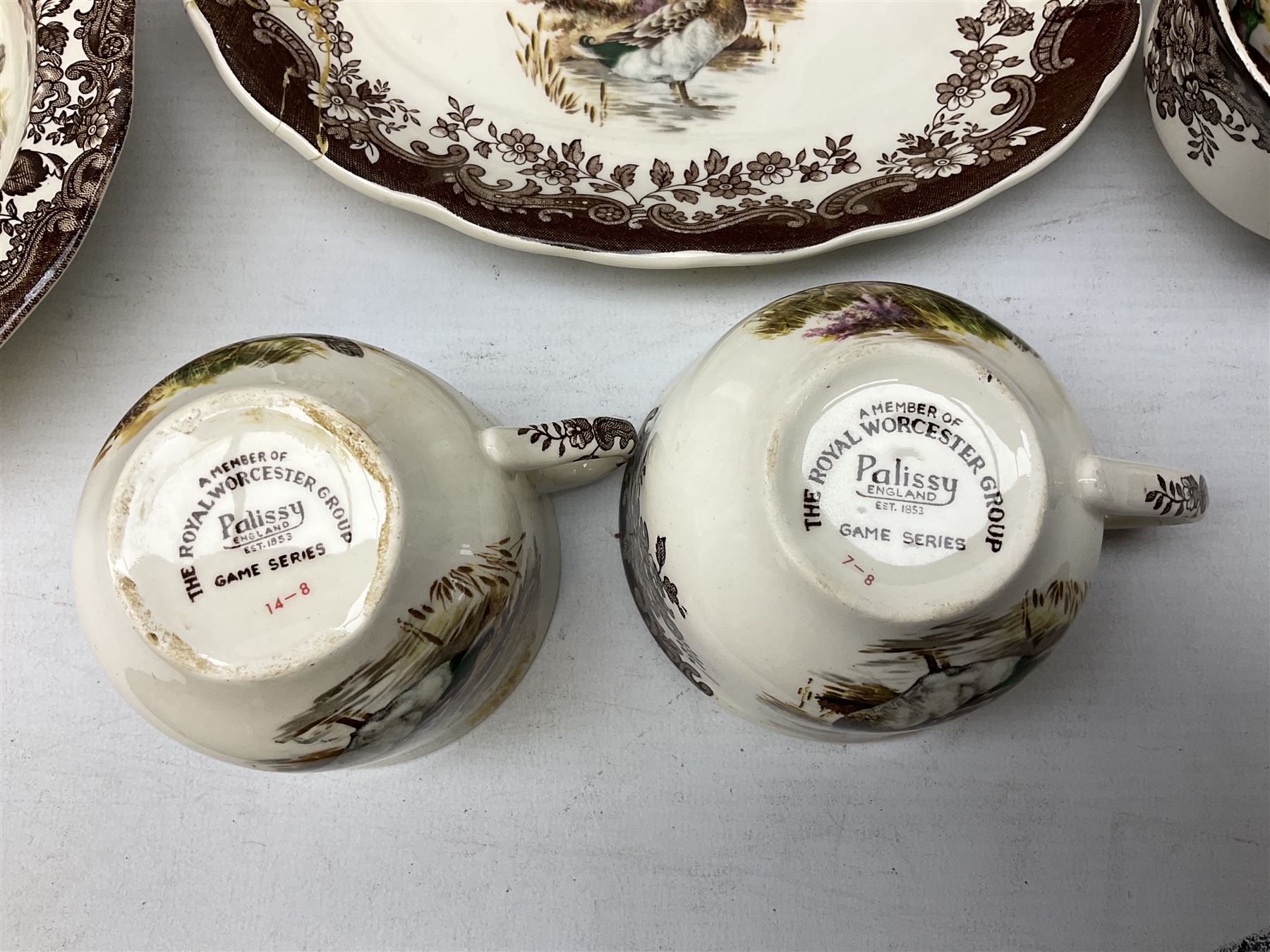 Royal Worcester Palissy Game Series pattern tea and dinner wares, to include two teapots, coffee pot, twelve cups and saucers in two sizes, four dinner plates etc (40) 