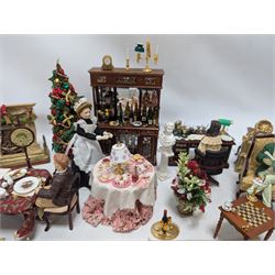 Dolls house living room and dining room furniture, including arm chairs, desk, fireplaces, dressers, tables, eight figures and a large collection of predominantly Christmas themed food, accessories and decorations