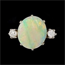 Early 20th century gold opal and diamond three stone ring, oval cut opal set with a single...