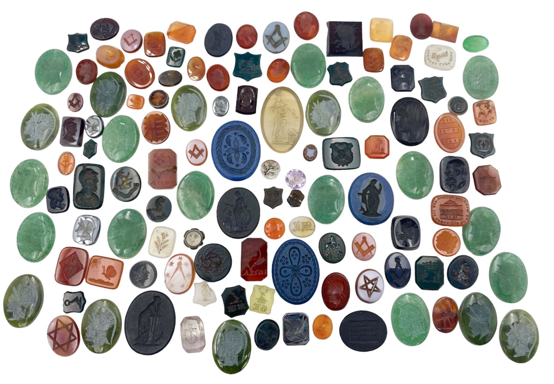 Collection of Georgian, Victorian and later loose intaglios including bloodstone, carnelian, aventurine and glass examples, depicting flowers, crests, Masonic symbols, figures, animals, lion heads etc, one inscribed ‘tis gone with its thorns and it’s roses 1806’ 