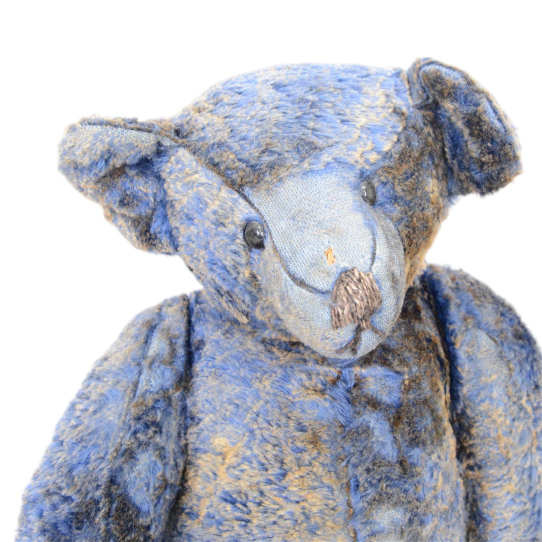 Eight early 20th century and later teddy bears, to include three straw filled examples with jointed limbs, tallest H58cm