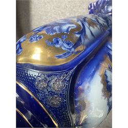 Staffordshire pottery jardiniere, decorated with flowers in blue and heightened in gilt, overall H46cm 