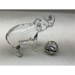 Collection of paperweights to include Baccarat clear glass elephant, L13cm, two boxed Caithness examples including Snow Trail, two boxed Swarovski paperwights and a Langham paperweight of pointed form with bubble inclusions, etc (8)