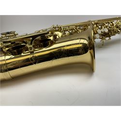 A gear4music brass tenor saxophone serial no.15080448 L67cm in fitted carrying case with accessories and music books
