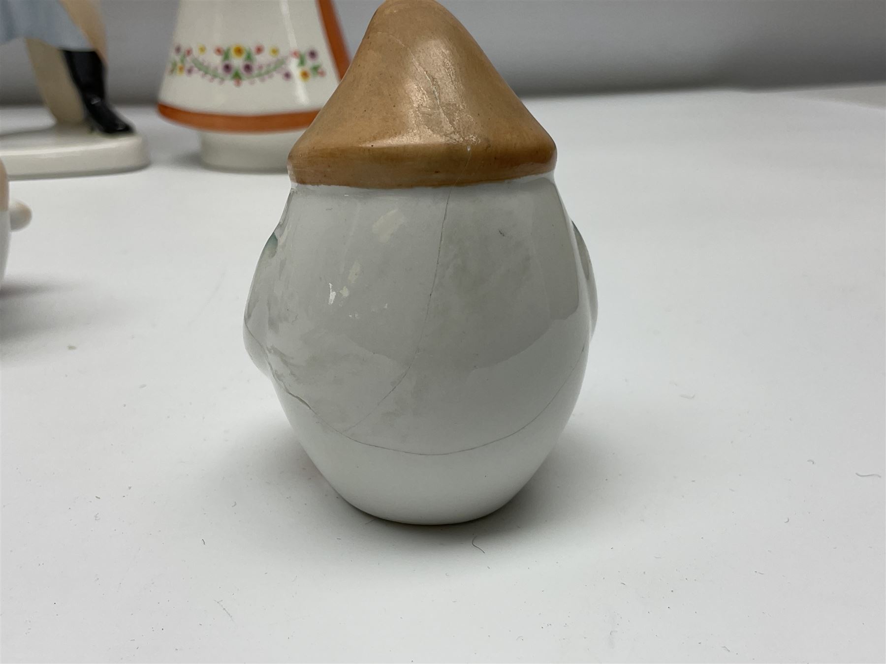 Group of eleven Aquincum of Budapest figures, comprising two of a man in a feather hat, seven dwarves, man and woman in traditional dress, all with printed marks beneath