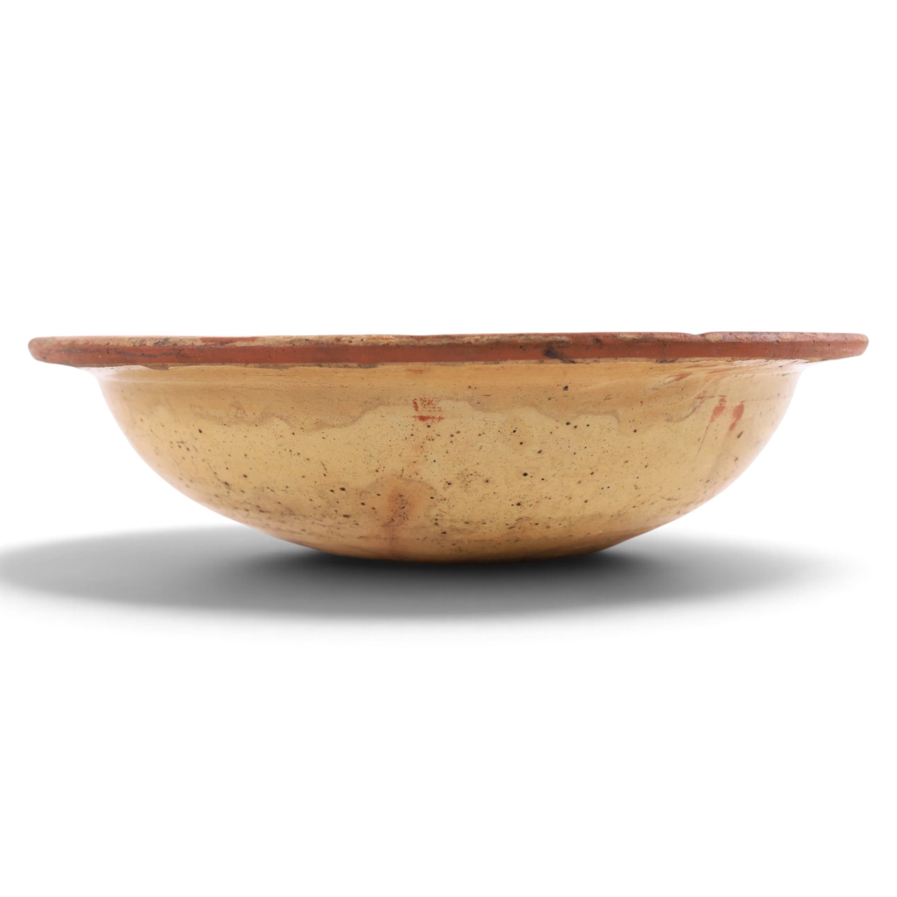 Spanish twin handled cooking pot, blackened to the outside, together with two bowls with slipware glaze, pot H22cm 